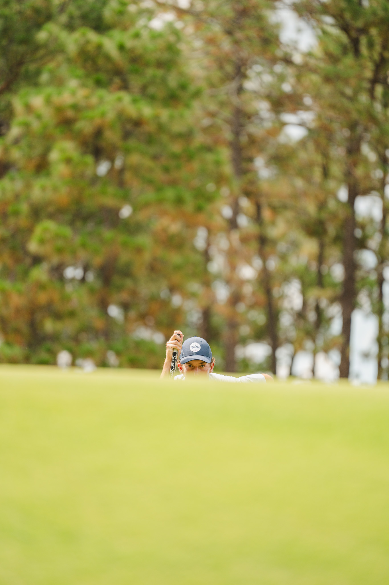 Jackson Van Paris lines up a putt on Saturday.