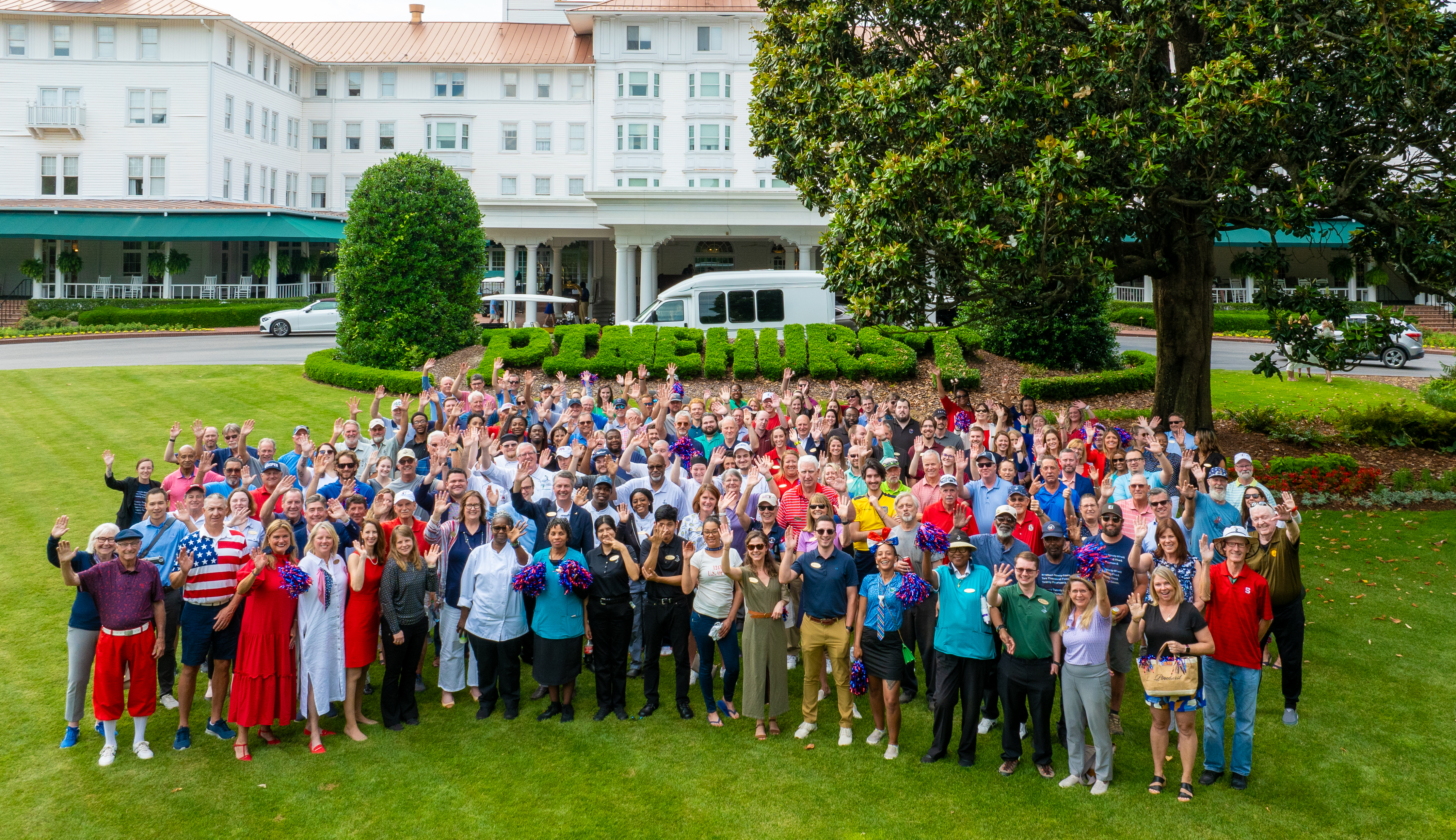 Pinehurst Resort employees gather together in front of the historic Carolina Hotel.